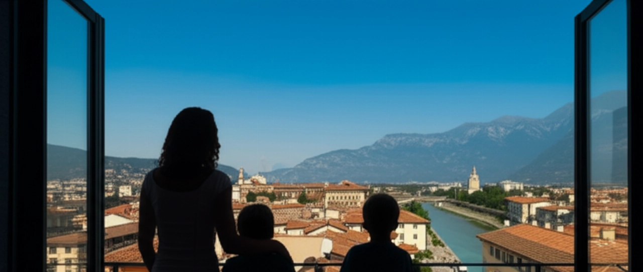 Famille caucasienne admirant la vue panoramique de Belluno et des Dolomites depuis le balcon de leur nouvelle maison, avec un camion de déménagement visible dans la rue.