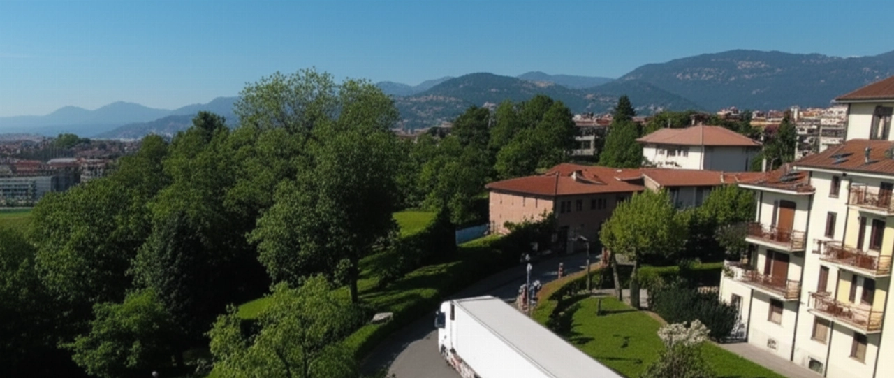 Vista aerea iperrealistica di un camion di traslochi parcheggiato in un quartiere residenziale di Biella, con le Alpi sullo sfondo.