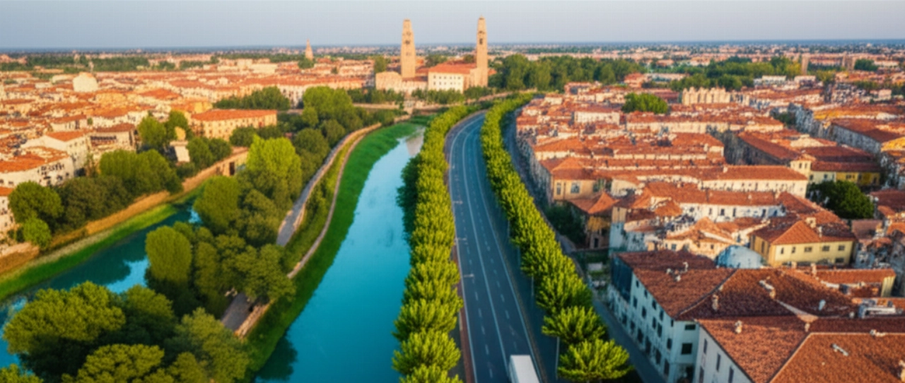 Hyperrealistic aerial view of a moving truck on a tree-lined avenue, with the historic Treviso cityscape in the background at sunset.